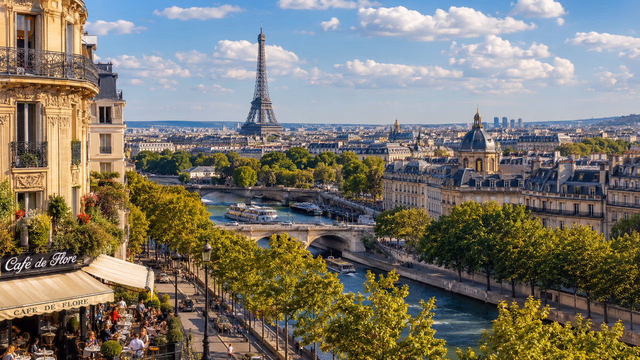 A view over central Paris in daylight, with the Eiffel Tower and the Seine beyond the Café de Flore terrace