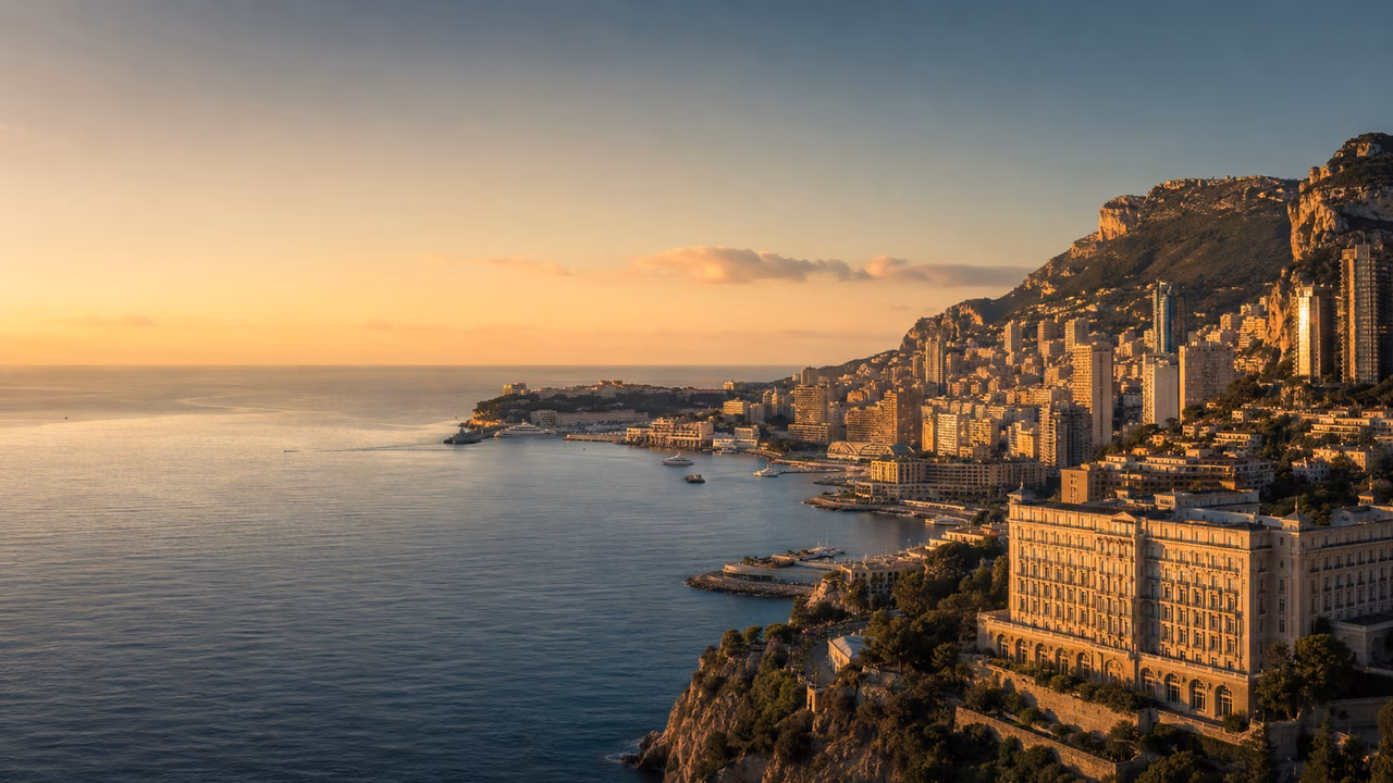 Monaco and the Mediterranean coastline at golden hour, seen from the cliffs above the principality